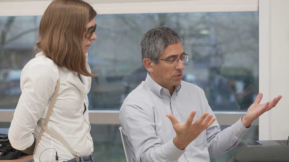 A Tektronix representative tells an engineering student about oscilloscopes