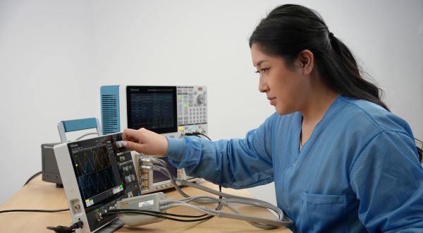 Engineer calibrating a 2 Series MSO oscilloscope